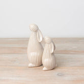 Standing ceramic bunny with a ribbed reactive glaze finish in white/cream. Ideal for Easter or spring décor.