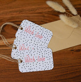 Set of red and black polka dot gift tags with "With Love" text, made from 100% recycled premium card. Includes string for easy attachment to gift wrapping.