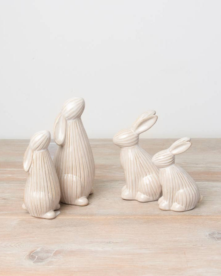 ceramic bunnies with a ribbed reactive glaze finish in white/cream. Ideal for Easter or spring décor.