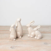 ceramic bunnies with a ribbed reactive glaze finish in white/cream. Ideal for Easter or spring décor.