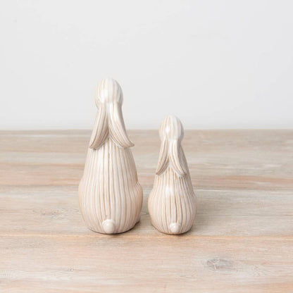 Standing ceramic bunny with a ribbed reactive glaze finish in white/cream. Ideal for Easter or spring décor.