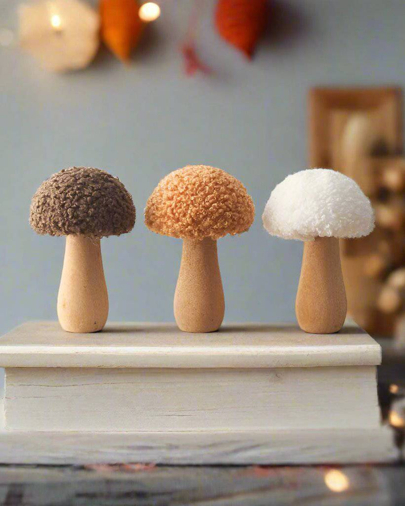 Set of three autumnal ornaments featuring sherpa fabric mushrooms with a natural, seasonal charm.