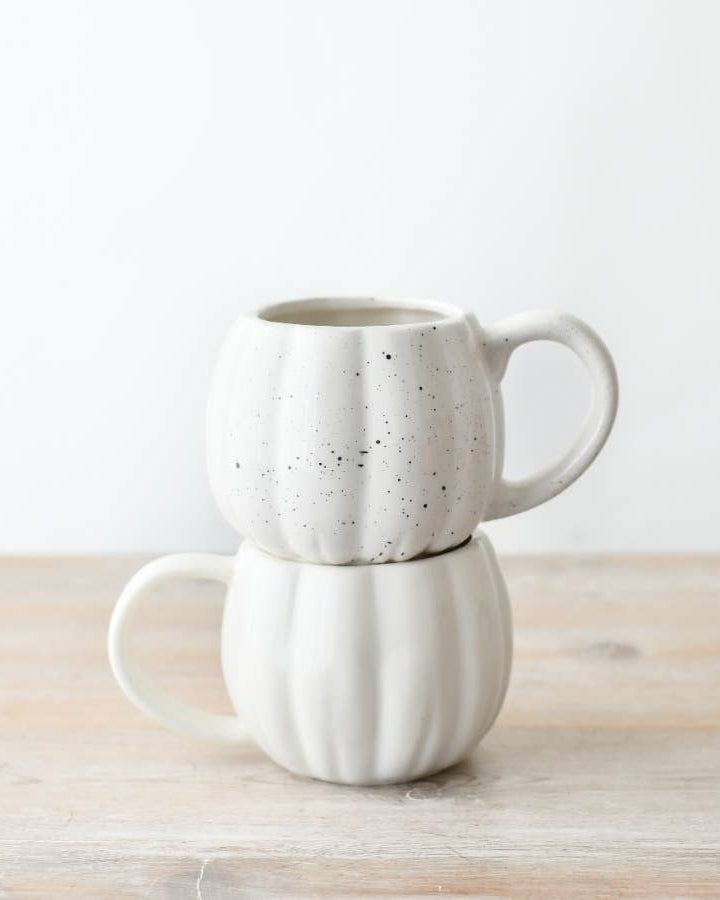 Hand-finished ceramic pumpkin mug in speckled white. A charming addition to autumn-inspired collections.