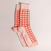 Orange socks featuring an all-over sunshine design. Made from 75% cotton for comfort, one size fits most.