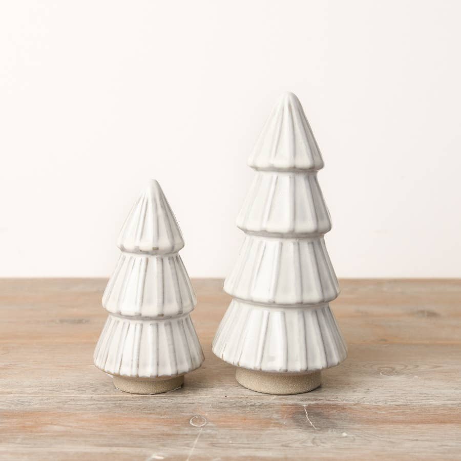 White ceramic tree ornament with a reactive glaze finish. An elegant addition to any minimalist or modern Christmas decor.