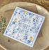 Square handmade Mother’s Day card featuring a vintage blue and yellow floral design with "Happy Mother’s Day" text in the centre. Packaged in a biodegradable cello wrap with a Kraft envelope.
