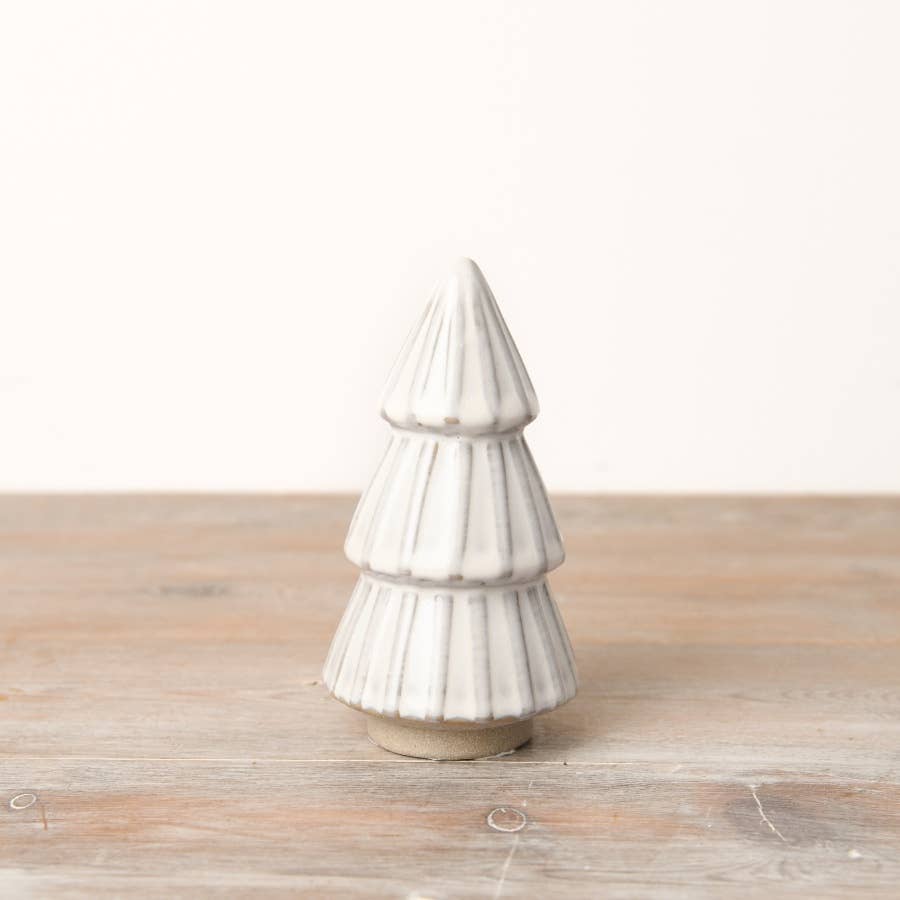  White ceramic tree ornament with a reactive glaze finish. An elegant addition to any minimalist or modern Christmas decor.